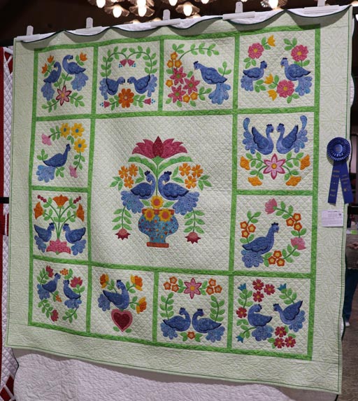 Birds-of-a-Feather-LargeAppliqued-Quilt-winner-QuiltShow2025