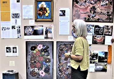 Susan Feller with rug display