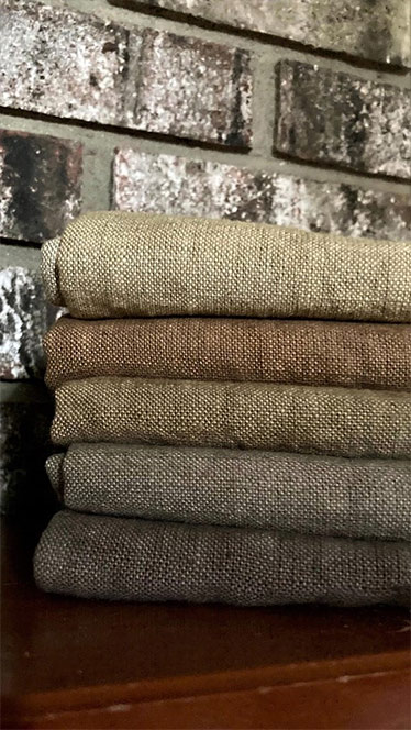 stack of wool Koehl workshop