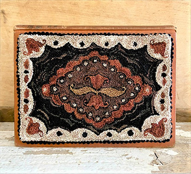 punchneedle rhombus lace pattern on book