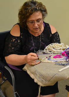 rug-hooker-at-workshop