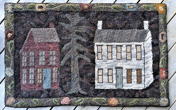 two houses with pine tree rug hooked by Jenny Smallridge