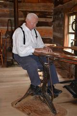 Costumed Guide Saw Cabinet Shop