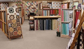 quilt-shop-multiple-fabrics-cutting-table