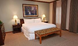 Hotel room at Heritage Inn with full amenities and king-sized bed